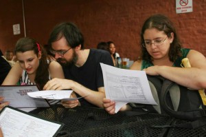 Students at a lekhayim sho at Franklin Park, reading a list of Yiddish drinking idioms.