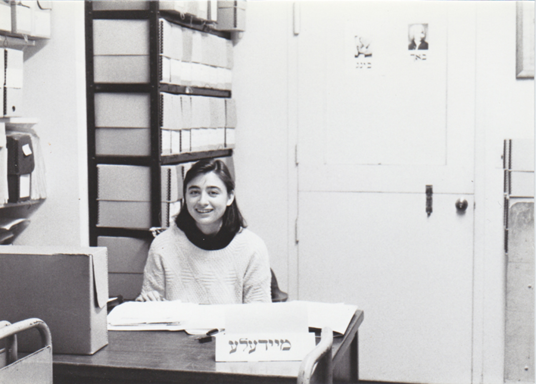 Cecile Kuznitz, now a professor at Bard College and a teacher in the Zumer Program, at YIVO in 1991. The Yiddish signs, “Meydele” (girl), “Bakh” (Bach), and “Bing” are examples of YIVO Archives humor of the time. Photo courtesy of Roberta Newman.